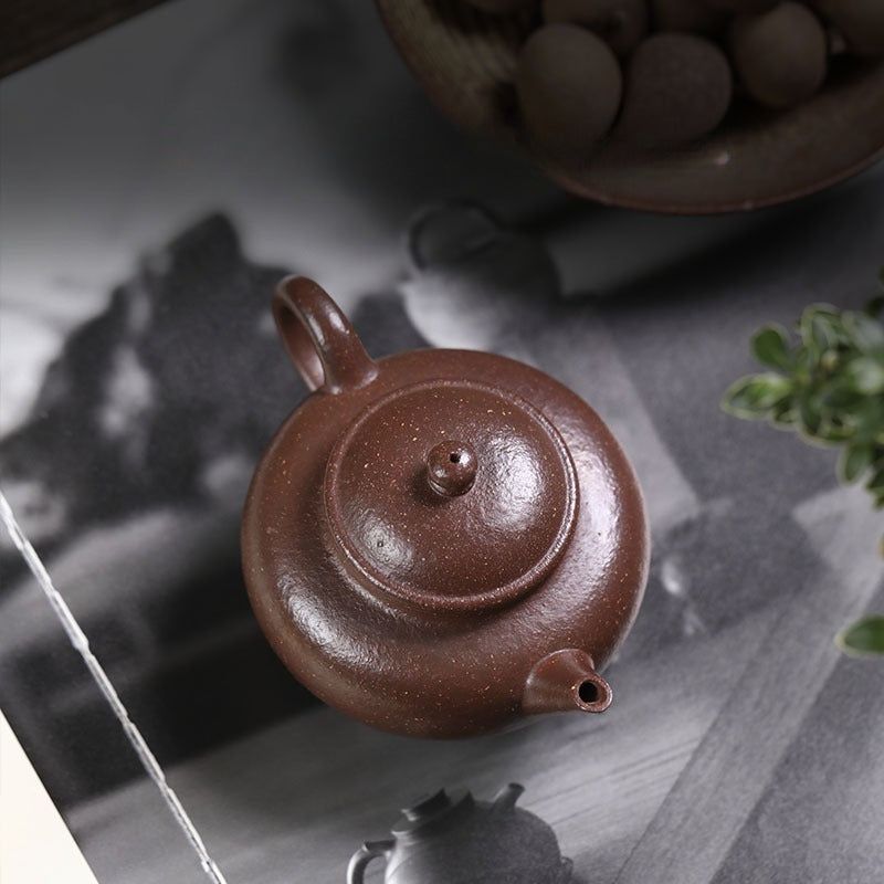 Théière Yixing Zisha entièrement faite à la main [trépied Shui Ping] (Tao Hua Ni - 210 ml)