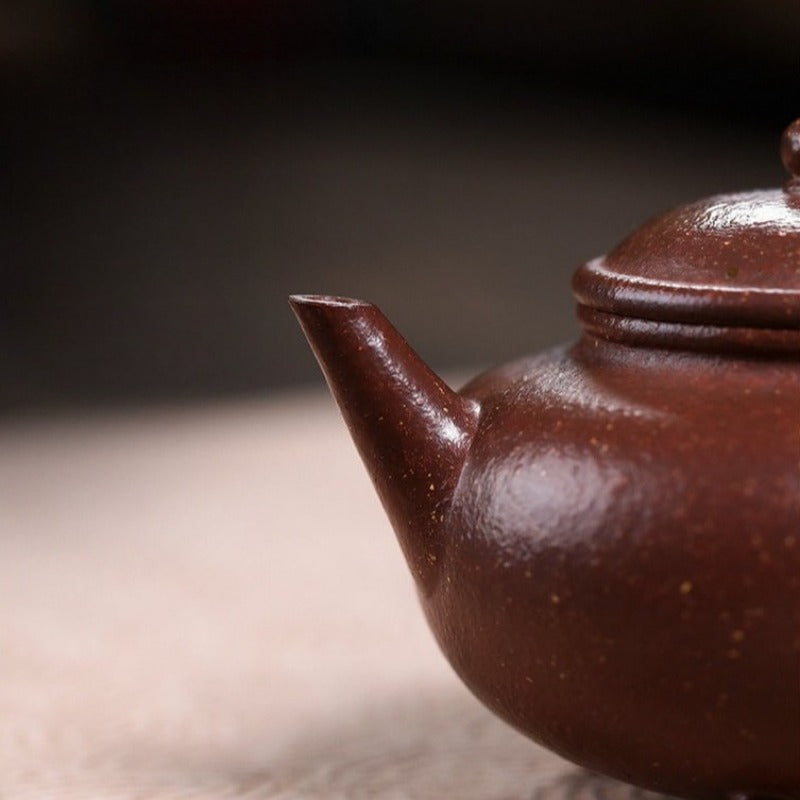 Théière Yixing Zisha entièrement faite à la main [trépied Shui Ping] (Tao Hua Ni - 210 ml)