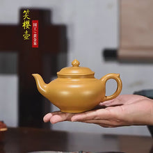 Load and play video in Gallery viewer, Full Handmade Yixing Zisha Teapot [Xiao Ying Pot 笑樱壶] (Huangjin Zhu Ni - 200ml)
