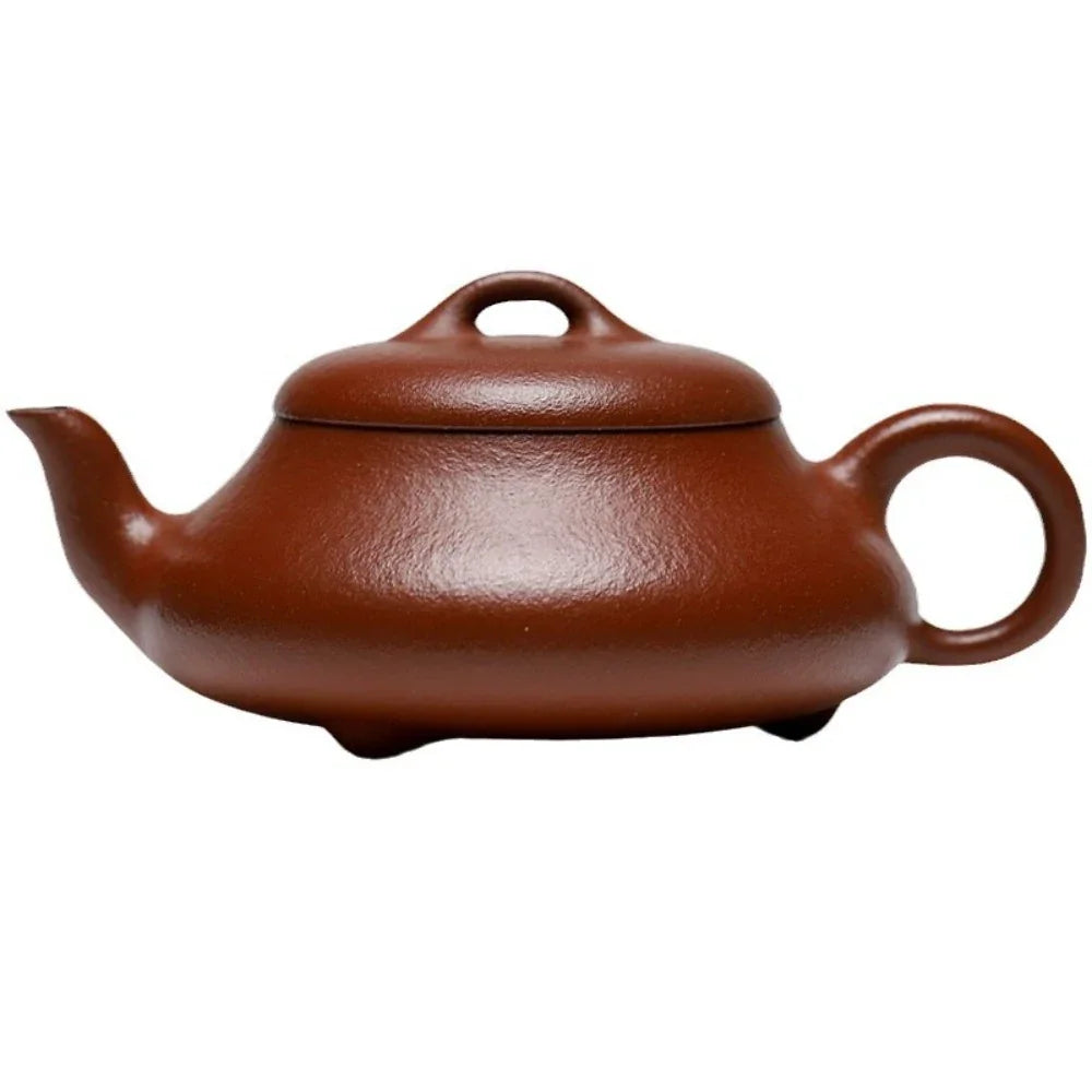 Brown ceramic teapot on a white background

