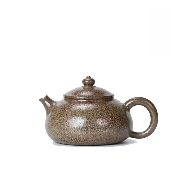 A traditional Chinese Yixing clay teapot with a speckled brown and beige glaze, shown on a plain white background.

