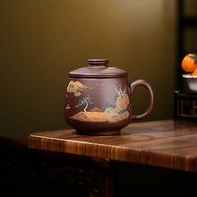 Load image into Gallery viewer, Yixing Purple Clay Tea Mug with Filter [Shanshui] | 宜兴紫砂泥绘 [山水] (带茶滤)盖杯 - YIQIN TEA HOUSE 一沁茶舍  |  yiqinteahouse.com
